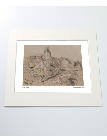 a mounted art print of a drawing of a beach scene with hat, water bottle towel and chips