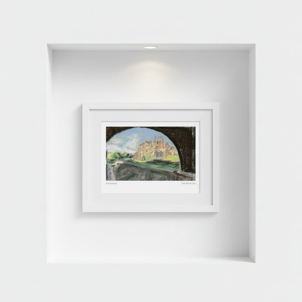 A framed art print depicting Biddulph Grange seen through a dark archway, displayed in a white frame on a white wall within a recessed niche.