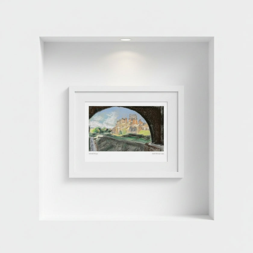 A framed art print depicting Biddulph Grange seen through a dark archway, displayed in a white frame on a white wall within a recessed niche.
