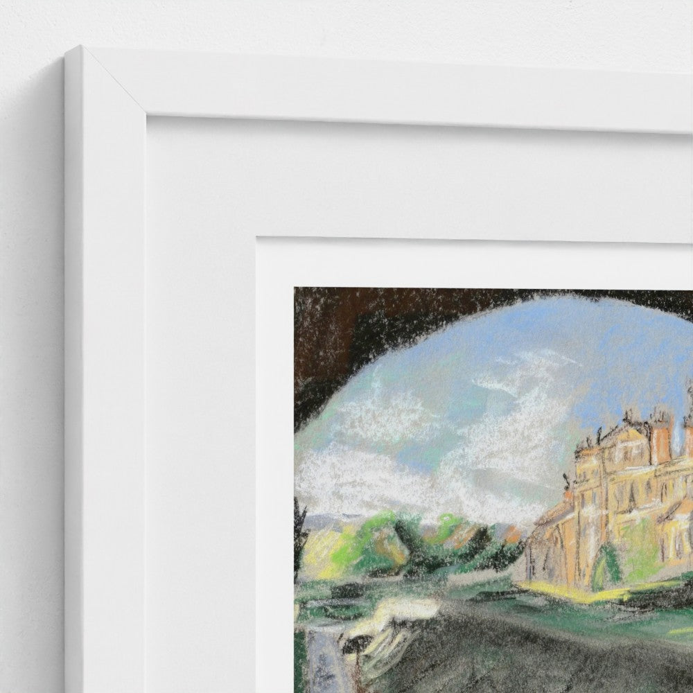 A close-up of a framed art print showing part of a pastel landscape drawing with a Biddulph Grange, trees, and sky, set in a white frame against a white wall.