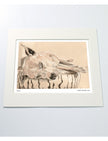 A matted art print featuring a drawing of a sleeping dog on a cushion, displayed against a light gray background.