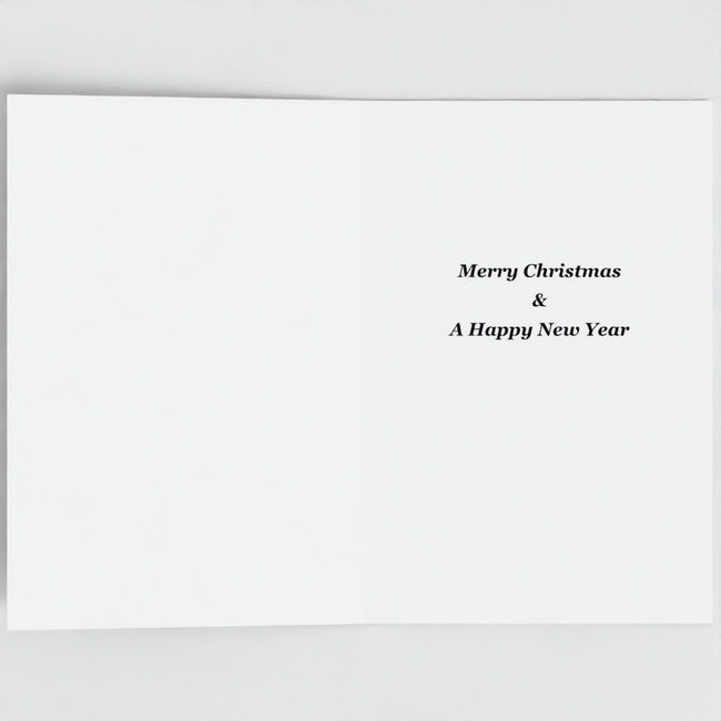 A minimalist white greeting card with elegant black serif text reading 'Merry Christmas & A Happy New Year' positioned on the right side, shown against a neutral light grey background.