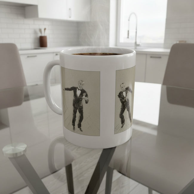 A white ceramic coffee mug with two vertical panels showing a black-and-white retro illustration of a man in a tuxedo, placed on a glass dining table in a bright modern kitchen.