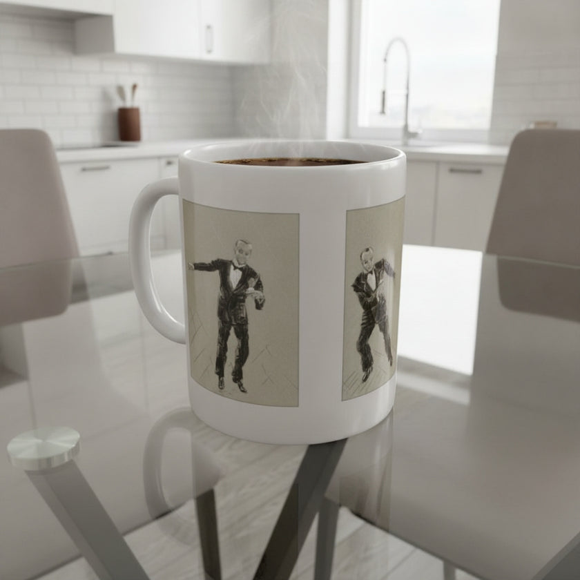 A white ceramic coffee mug with two vertical panels showing a black-and-white retro illustration of a man in a tuxedo, placed on a glass dining table in a bright modern kitchen.