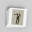 A stack of square white coasters with rounded corners, featuring a vintage-style sepia illustration of a man in a tuxedo on the top coaster, photographed on a light gray background.