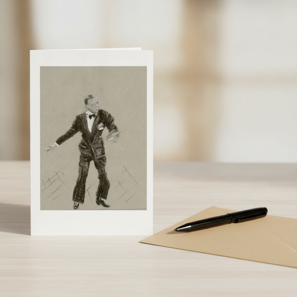 A greeting card with a black and white sketch of Fred Astaire, displayed on a light wooden table next to a brown envelope and a black pen.