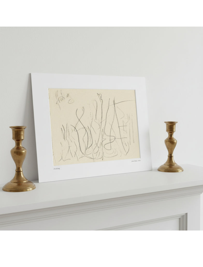 A mounted abstract line drawing in beige and black sits on a white mantelpiece, flanked by two gold candlesticks against a light gray wall.