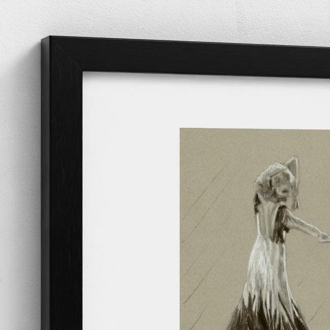 A close-up of a framed art print featuring a monochrome sketch of a dancer on a beige background, set in a black frame with a white mat against a light grey wall.