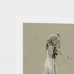 A square art print featuring a monochrome sketch of a woman in a flowing dress, shown against a white border on a light textured background.