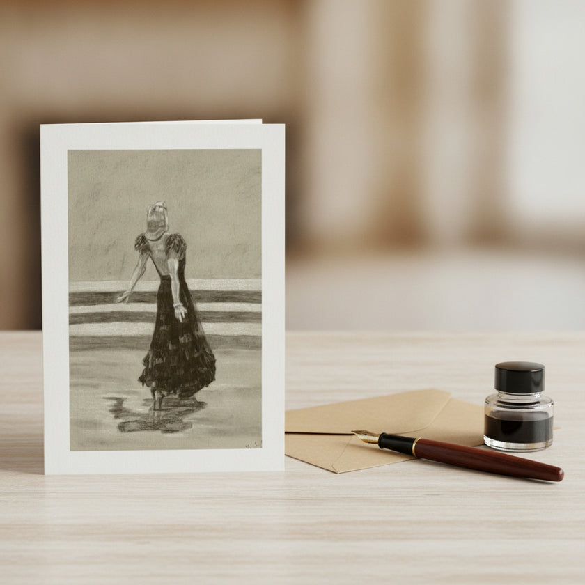 A vertical art print card featuring a black and white sketch of ginger Rogers in a long dress standing on a shiny surface displayed on a light wood surface next to a brown envelope, a fountain pen, and a small ink bottle.