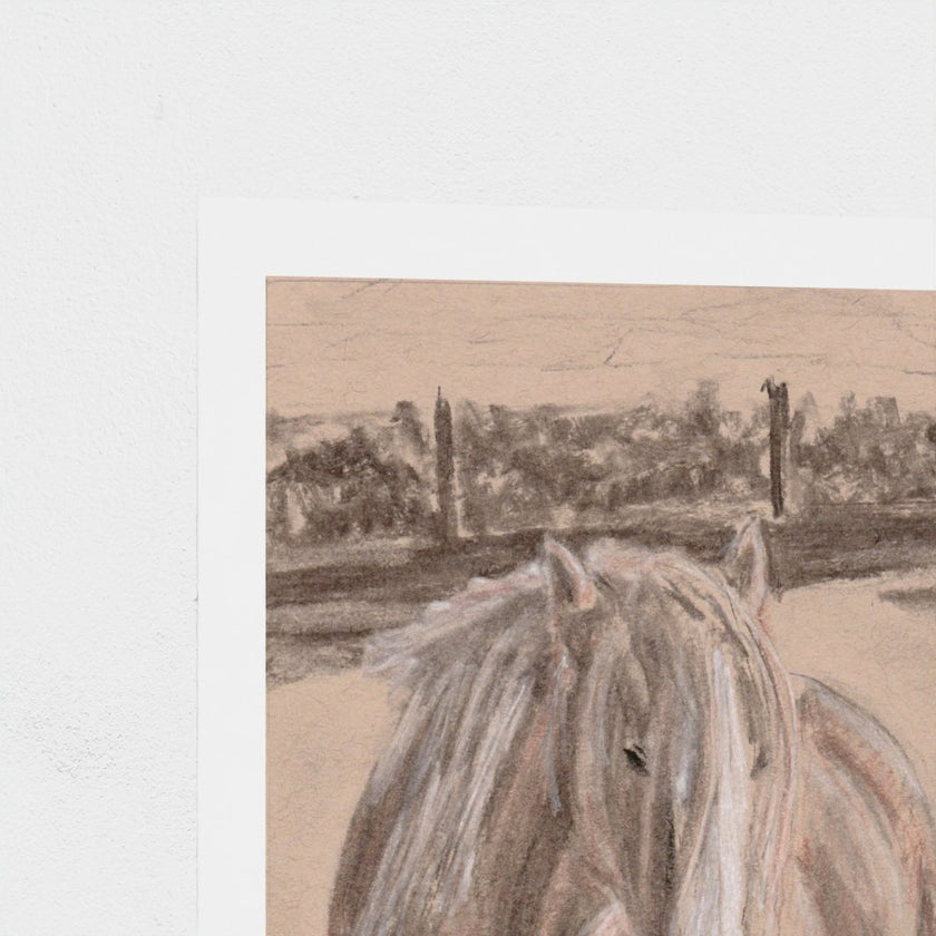 A close-up of a printed artwork showing the back of a pale horse in front of a softly sketched landscape, with a white border on a light neutral background.