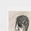 A close-up of a textured art print featuring a charcoal or pencil sketch of a stylized face, set against a clean white background.