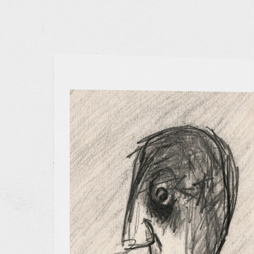 A close-up of a textured art print featuring a charcoal or pencil sketch of a stylized face, set against a clean white background.
