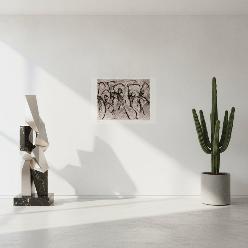 A black and white art print hanging on a white wall in a styled living room setting with a dark gray leather armchair, a wooden side table, a potted plant, and a floor lamp.