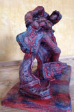 Ceramic sculpture of a rock guitarist painted red