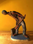 Ceramic sculpture of a punk guitarist