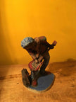 Ceramic sculpture of a punk guitarist