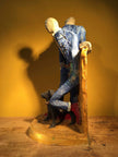 Ceramic sculpture of two skinheads with a dog
