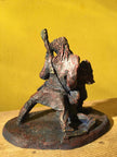Ceramic sculpture of a singer and guitarist painted red.