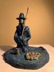 Ceramic sculpture of a Pilgrim Father preacher