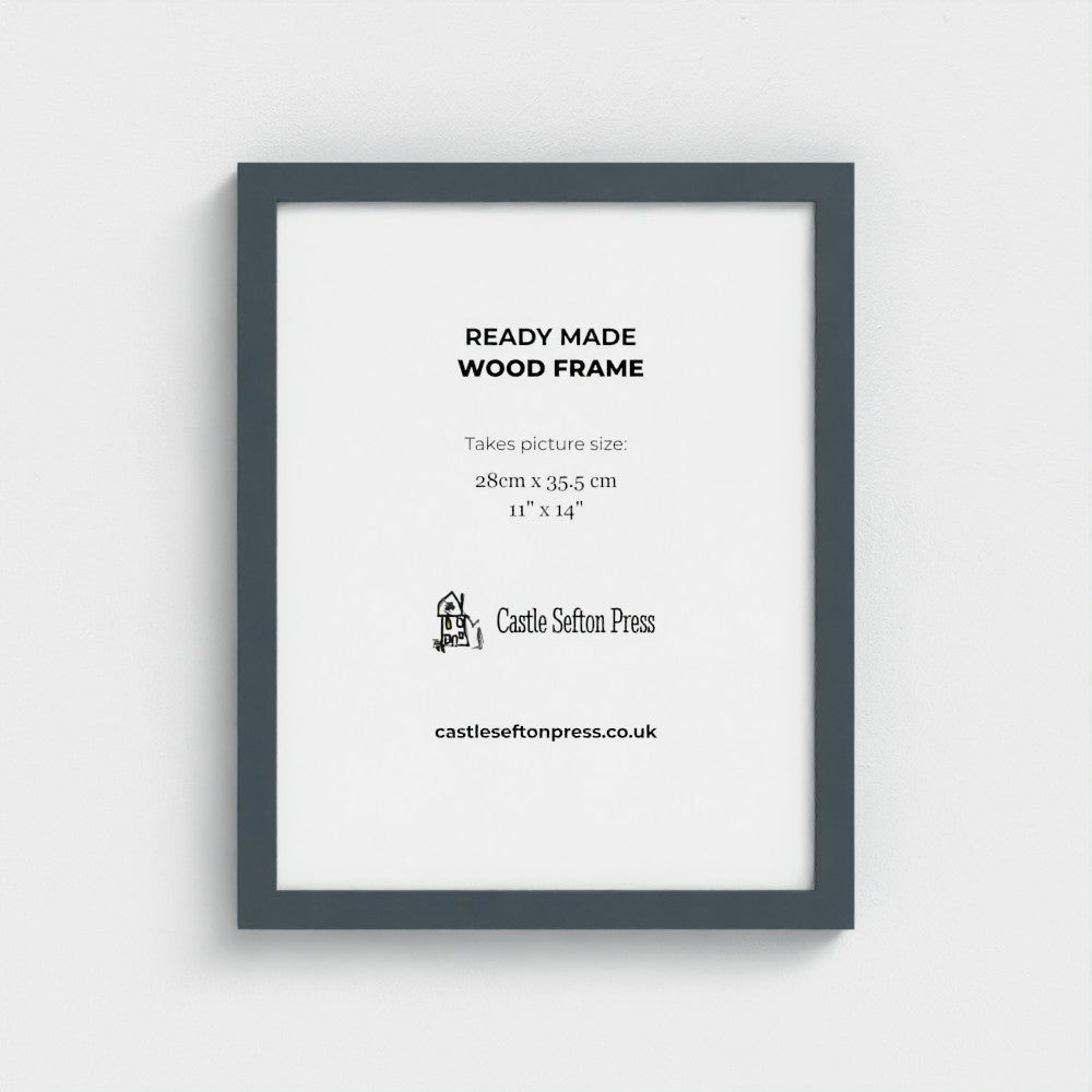 A light natural wood picture frame with a white mat, displaying product information text for Castle Sefton Press, shown against a neutral light grey background.