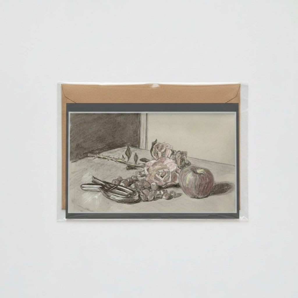 A card featuring a monochrome still life sketch of flowers, fruit, and a pair of nutcrackers, mounted on a brown kraft envelope against a light gray background.