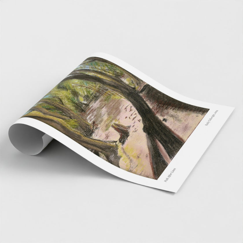 A rolled-out art print showing a painted forest scene with tree branches and a pale sky, photographed on a clean light grey background.