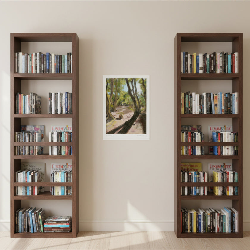 A landscape art print on a cream wall between two bookcases