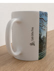 Winter Sun Through trees mug showing an acrylitc painting of winter woodland