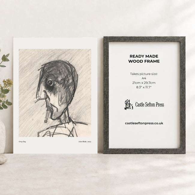 an art print of a head smoking next to an antique silver picture frame