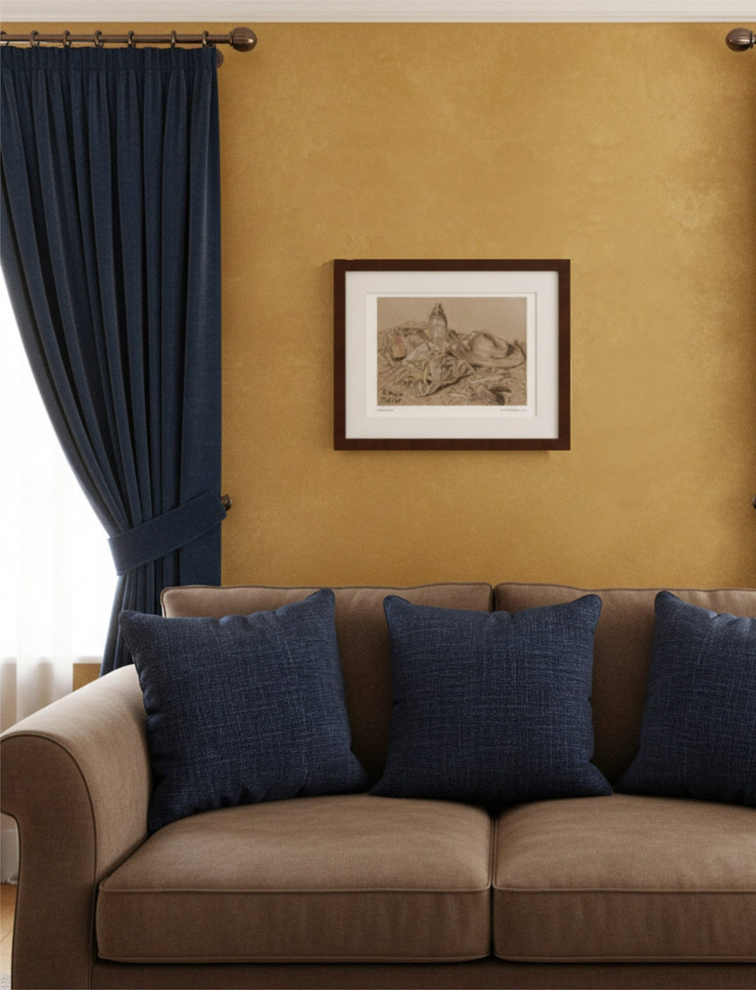 At the Seaside Framed Art Print with a brown sofa and blue curtains and cushions