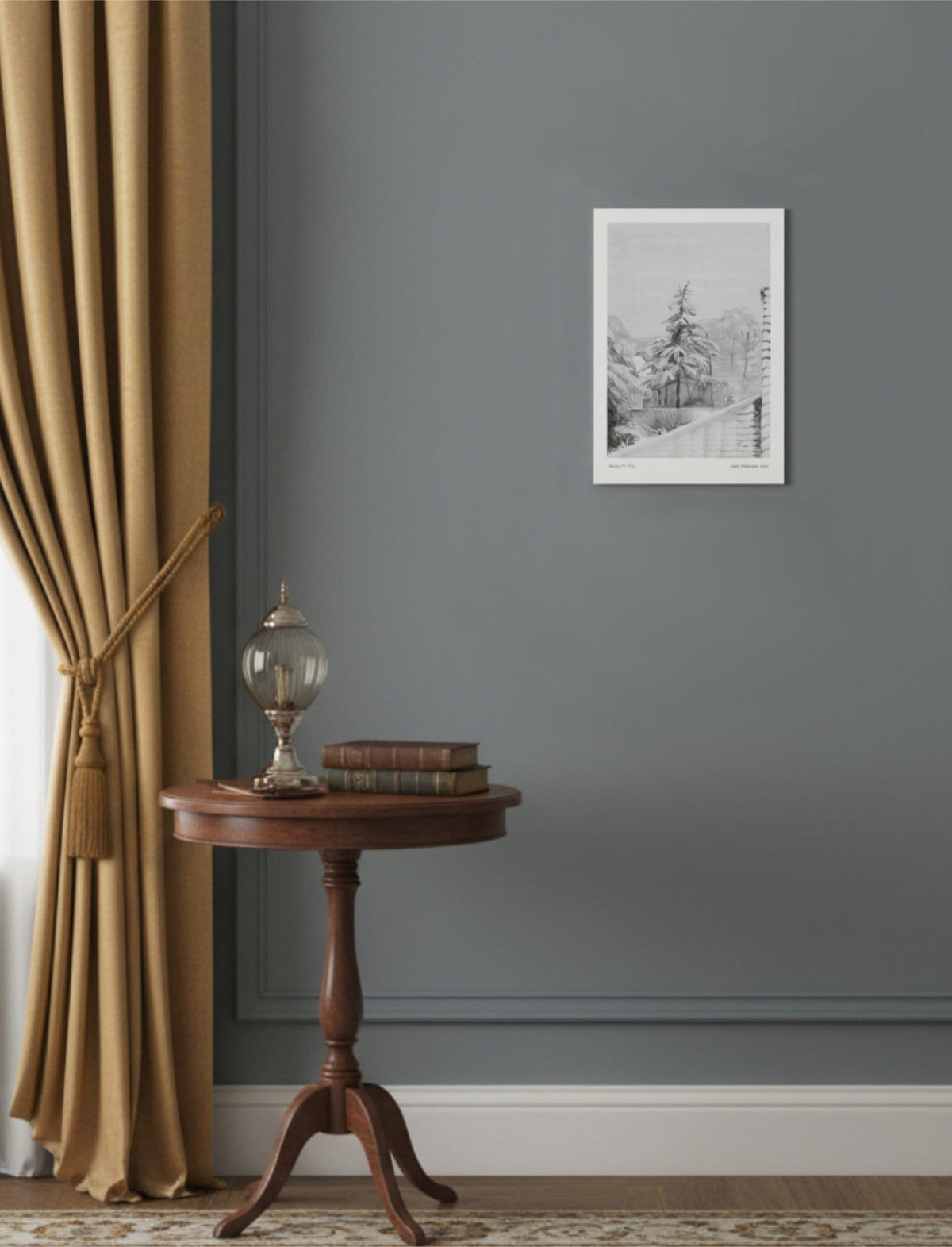 Snowy Fir Tree Art Print A4 on a blue grey wall with gold curtains and a round side table