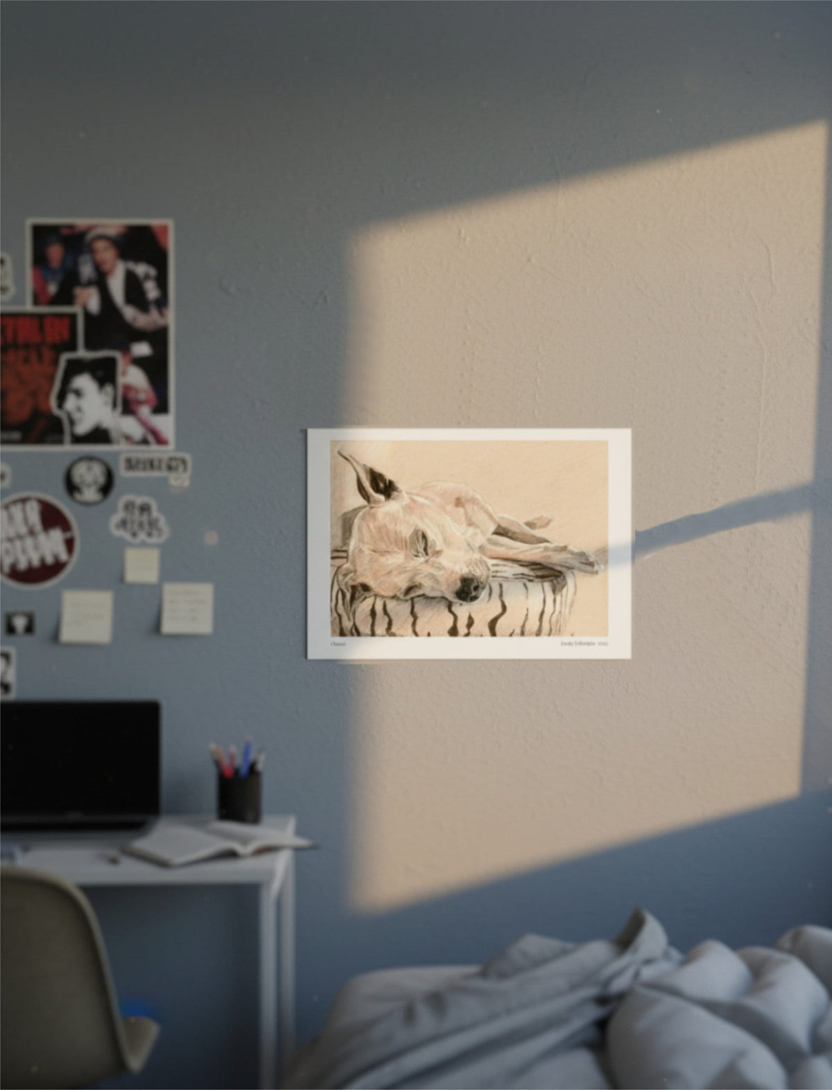 Chance the Staffordshire Bull Terrier Art Print on a blue wall above an unmade bed next to rock band posters