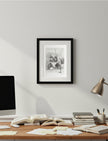 Edith the Cat Framed Art Print over a desk with computer and lamp