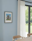 Sunny Summer at Stonehenge Framed Art Print on a blue wall in a dining room