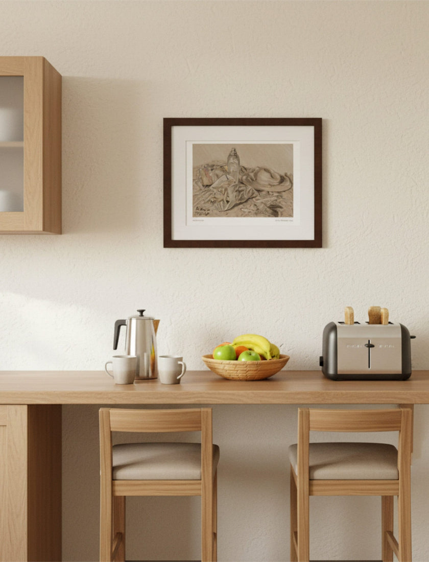 At the Seaside Framed Art Print above a breakfast bar with toaster, coffee pot, mugs and fruit bowl