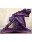 Ceramic sculpture of a rock guitarist painted red