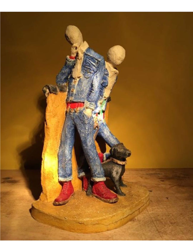 Ceramic sculpture of two skinheads with a dog