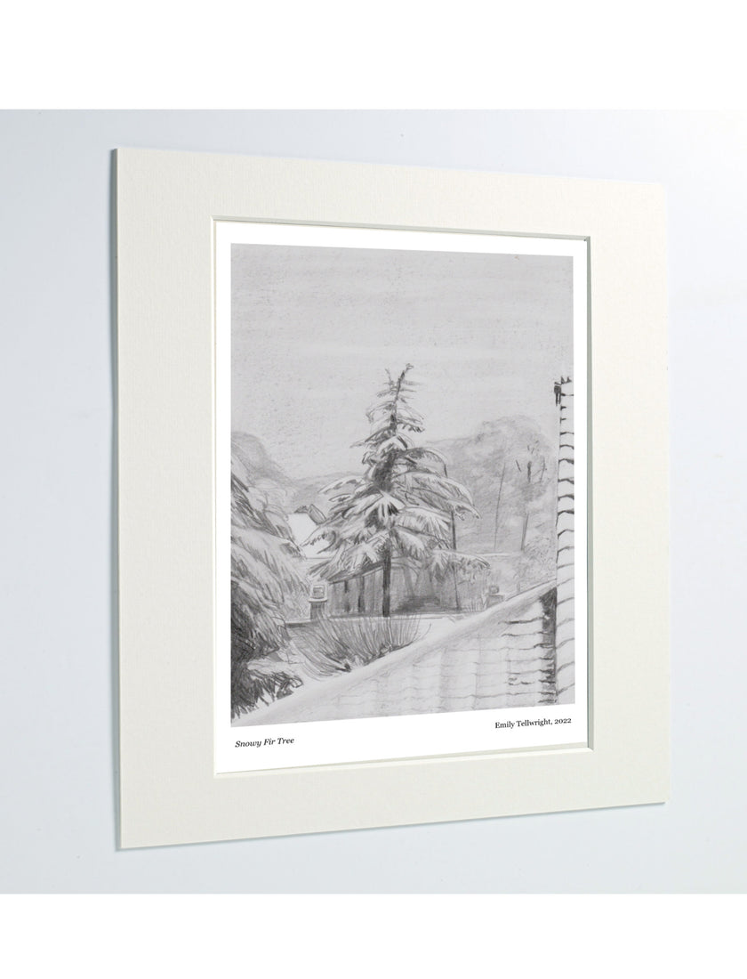 A matted art print featuring a pencil drawing of a fir tree in snow displayed against a light gray background.