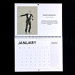 A vintage January spiral-bound calendar page displayed against a black background. The page features an illustration of a man in a tuxedo, text reading 'Fantastic Fred Actaire No 1' by Emily Tellwright, a January calendar grid, and a notes section.