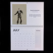 A july calendar page with a drawing of fred astaire by emily tellwright