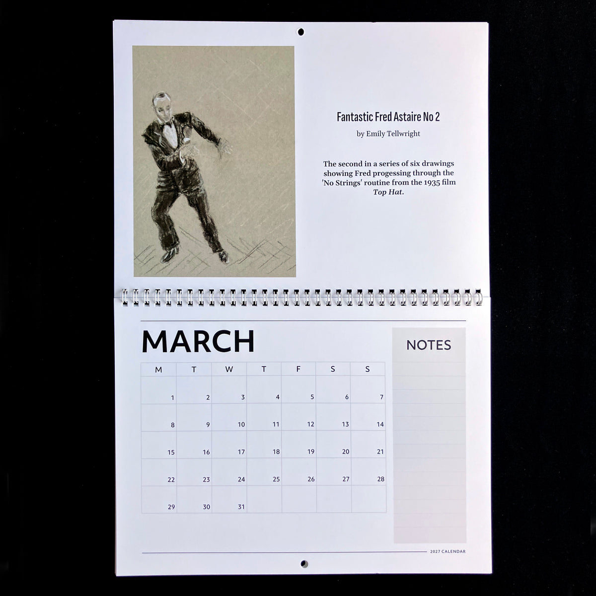 A spiral-bound calendar page from March featuring a black-and-white sketch of a man in a tuxedo with the title 'Fantastic Fred Astaire No 2' and a printed notes section, photographed against a black background.