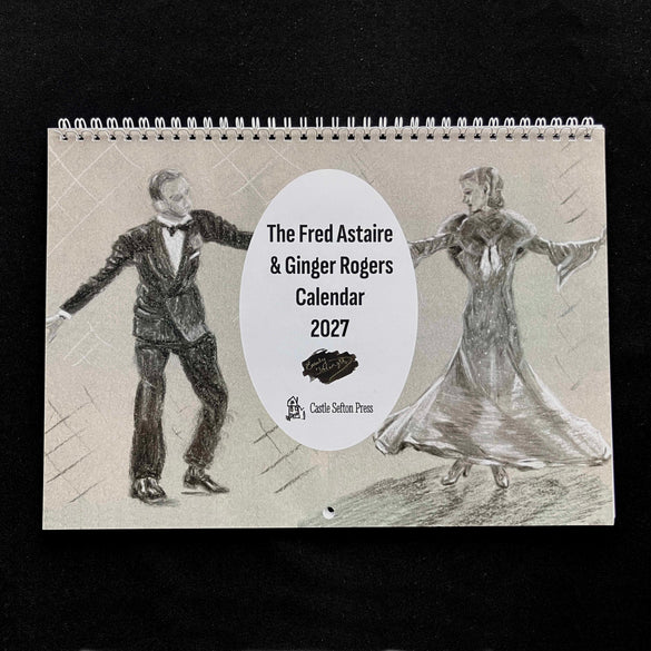A wire bound calendar for 2027 showing drawings of fred astaire and ginger rogers