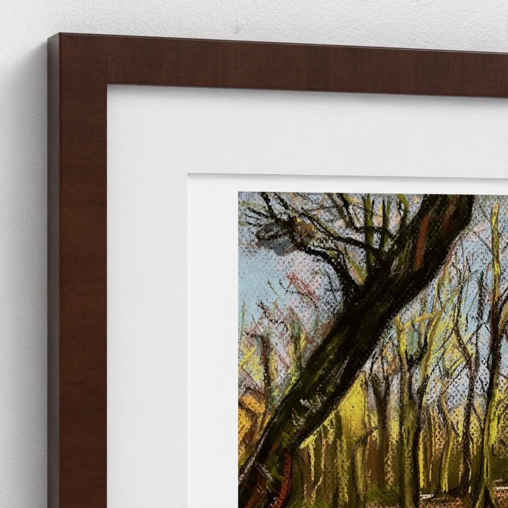 A framed art print featuring an impressionistic painting of a forest with a prominent leaning tree, styled with a dark brown frame and white matting against a light gray wall.