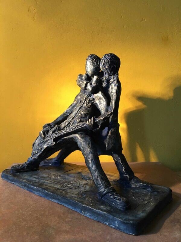 Ceramic sculpture of a rock singer and guitarist