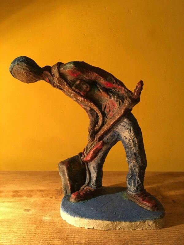 Ceramic sculpture of a punk guitarist