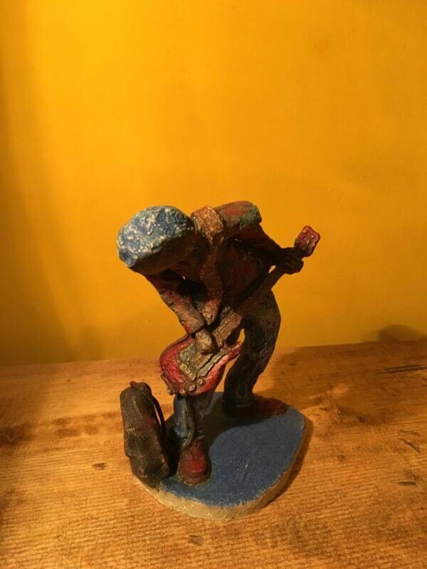 Ceramic sculpture of a punk guitarist