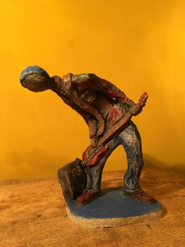 Ceramic sculpture of a punk guitarist