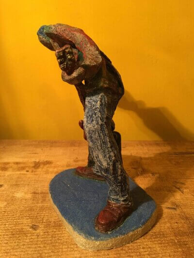 Ceramic sculpture of a punk guitarist
