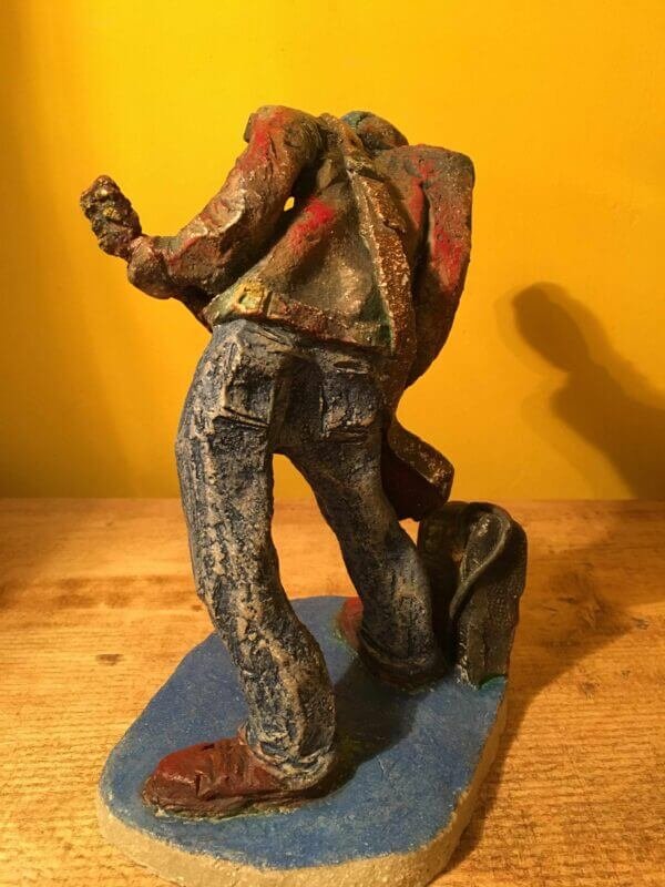 Ceramic sculpture of a punk guitarist